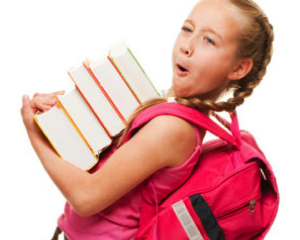 Description: girl holding large stack of books